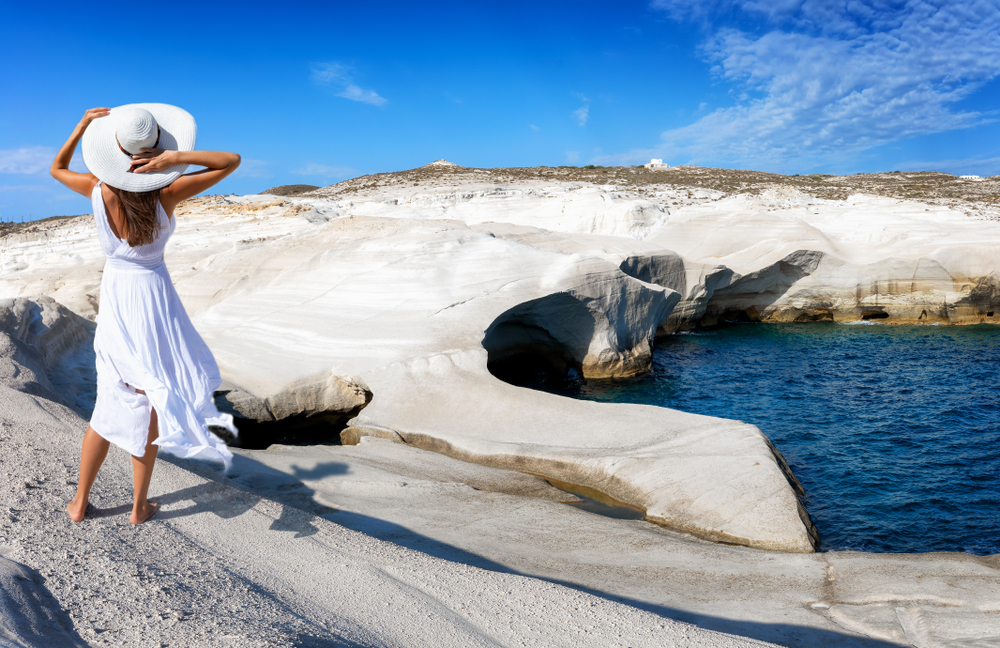 Beautiful,Woman,In,White,Dress,Walks,Through,The,Volcanic,Landscape